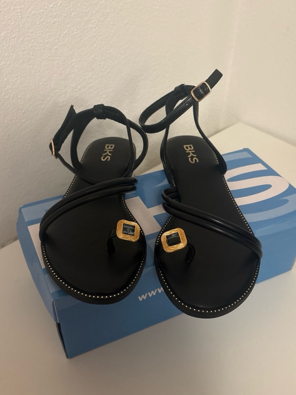 Bakers Black Ankle-Strap Toe-Ring Sandals with Gold Accents